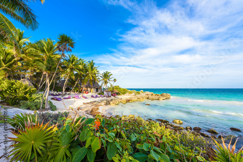 Recreation at paradise beach resort with turquoise waters of Caribbean Sea at Tulum, close to Cancun, Riviera Maya, tropical destination for vacation, Mexico