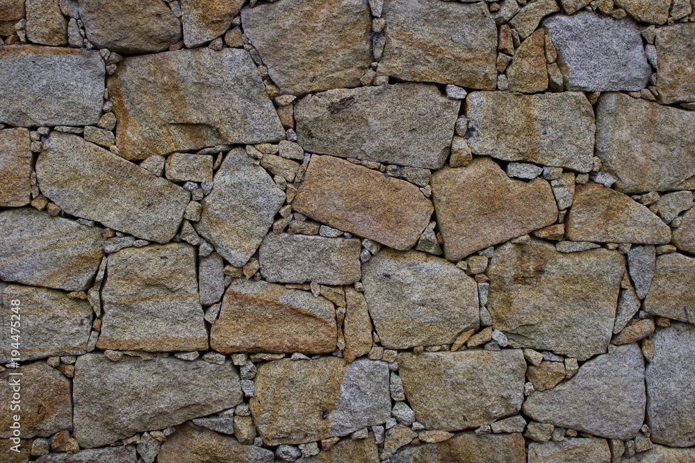 Muro em pedra de granito com junta seca Stock Photo
