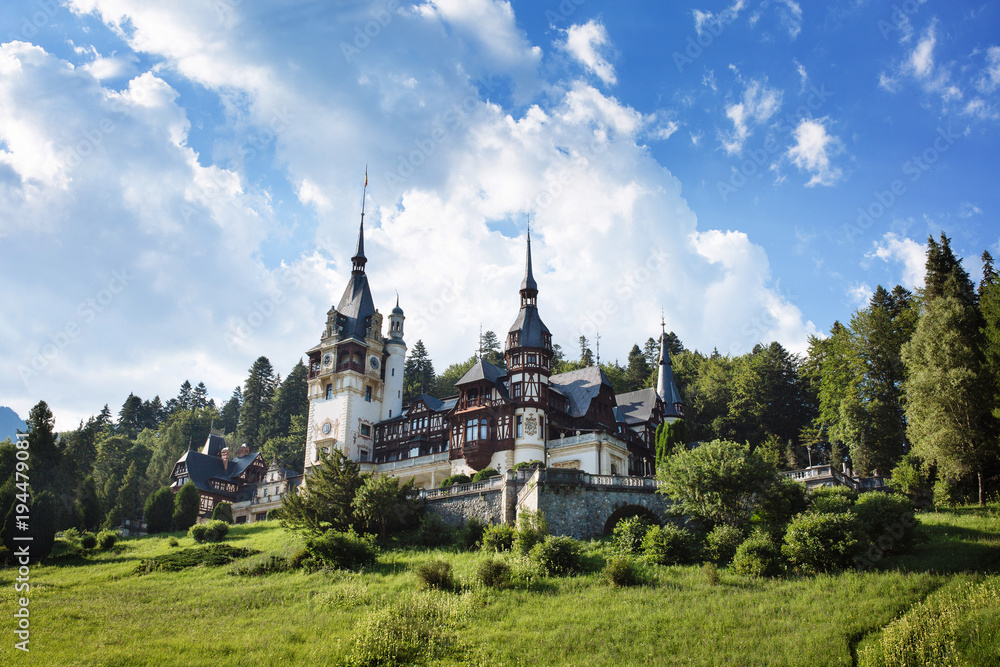 Scenic view on Peles castle, Sinaia, Transylvania, Romania. Summer travel postcard.