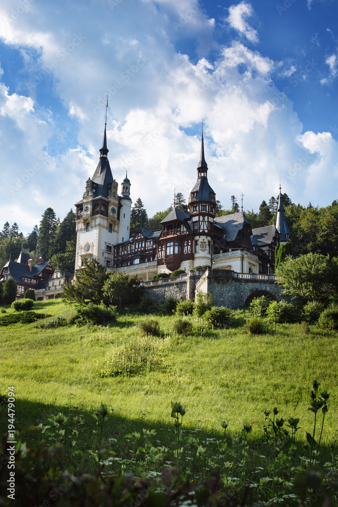 Scenic view on Peles castle, Sinaia, Transylvania, Romania. Summer travel postcard.