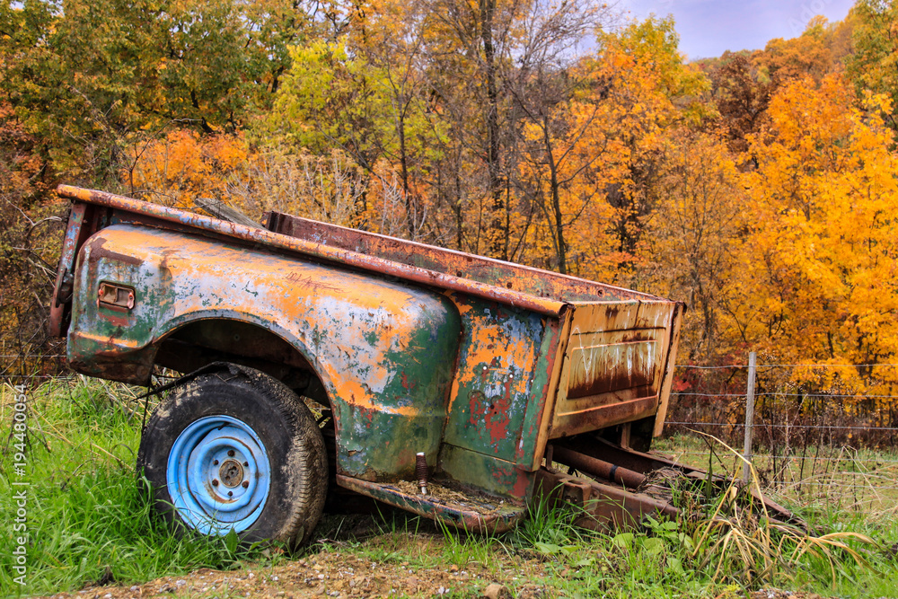 Old pickup truck bed converted to trailer and abandoned in woods. Old pickup truck bed converted to trailer and abandoned in woods.