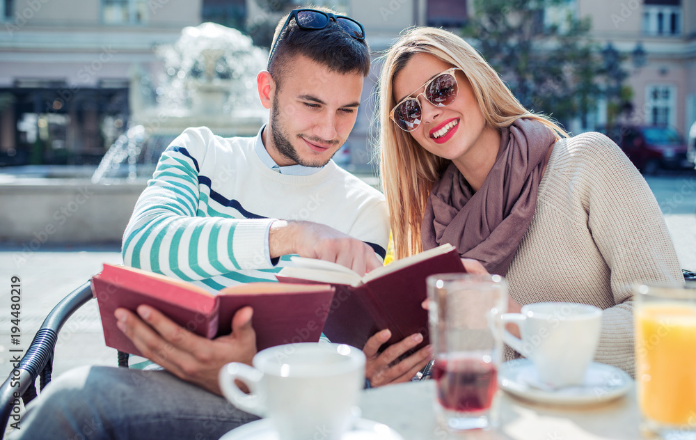 Dating. Young couple drinking coffee in the cafe. Education, relationships, love, lifestyle concept Dating. Young couple drinking coffee in the cafe. Education, relationships, love, lifestyle concept