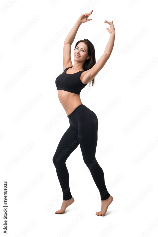 Brunette in sportswear dancing isolated shot Brunette in sportswear dancing isolated shot