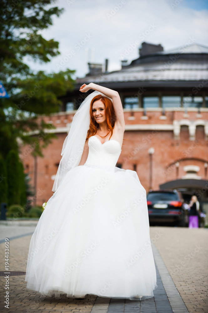 Fashion bride girl in gorgeous wedding dress with wedding bouquet of flowers Fashion bride girl in gorgeous wedding dress with wedding bouquet of flowers
