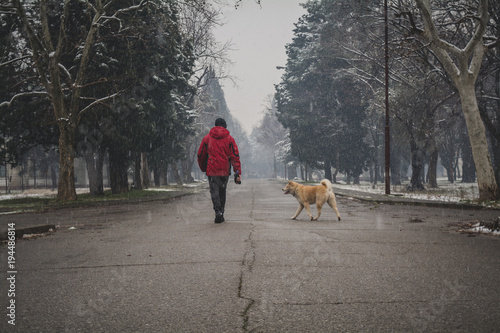 Walking a dog on a snowy day