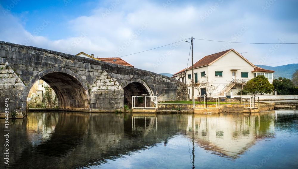 Picturesque portuguese village with a roman bridge