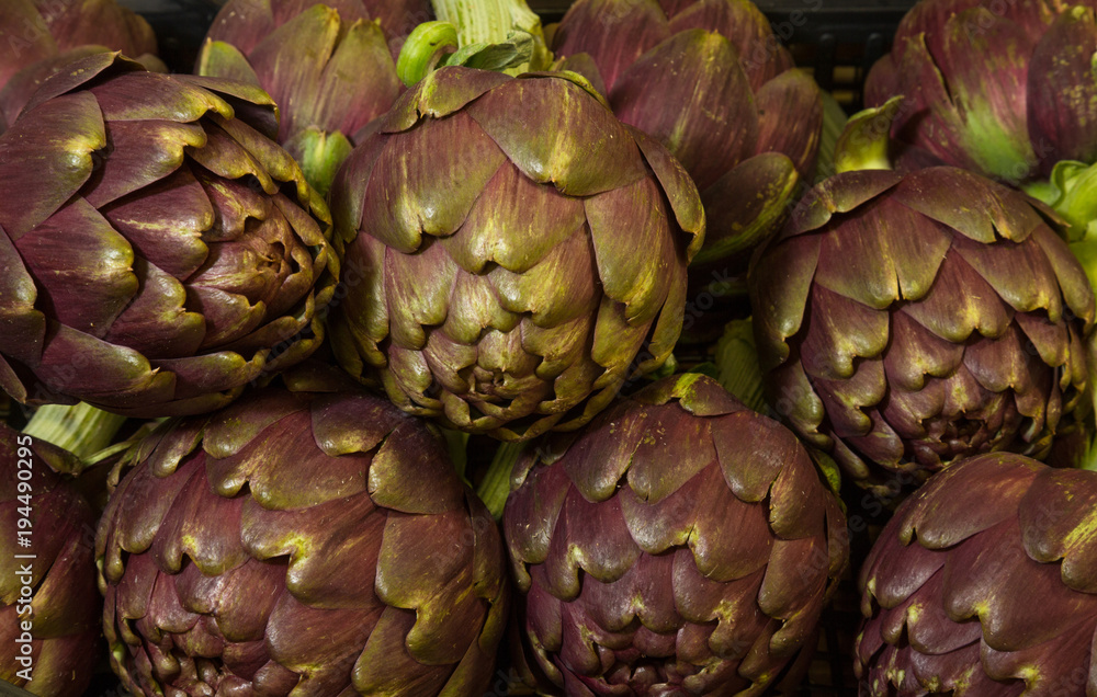 Fototapeta premium pile of purple artichokes