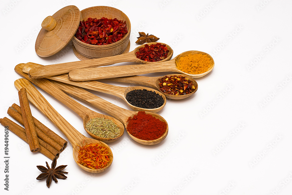 Spice. Spice in a wooden spoon. Herbs. Curry, saffron, turmeric, pepper and other isolated on white background. Spice. Spice in a wooden spoon. Herbs. Curry, saffron, turmeric, pepper and other isolated on white background.