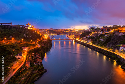 High Angle view on the Douro River and Dom Luis I Bridge in Porto Portugal at Dusk