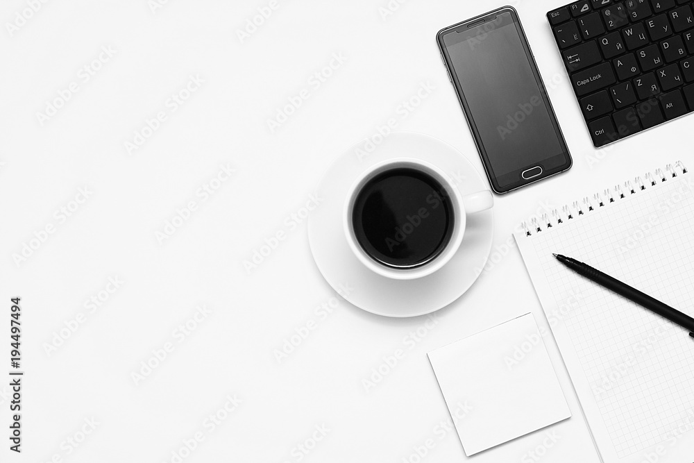 Mixing stationery and gadgets on a white background. View from above. Toning. Mixing stationery and gadgets on a white background. View from above. Toning.