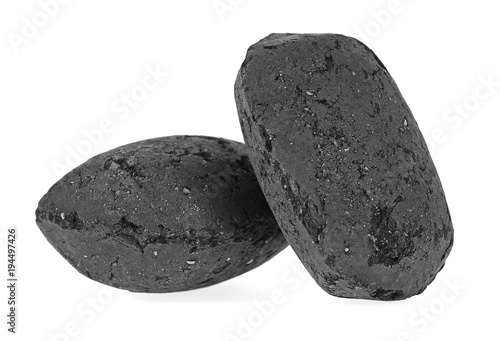 Charcoal briquettes isolated on white background