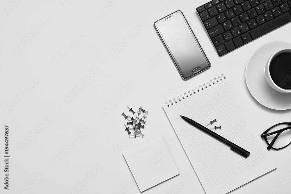 Mixing stationery and gadgets on a white background. View from above. Toning. Mixing stationery and gadgets on a white background. View from above. Toning.