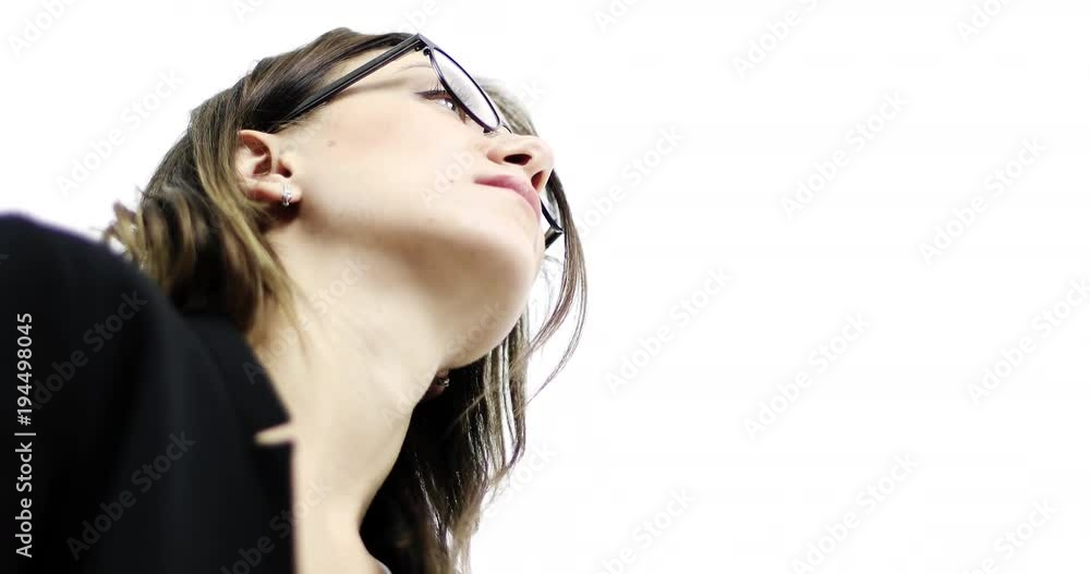 Business woman in glasses looking down to the camera.
