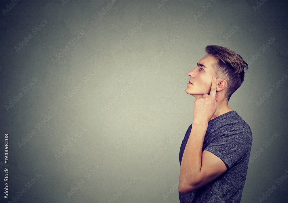 Wondering young man in contemplation Wondering young man in contemplation