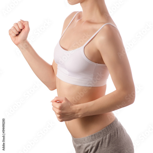 Young beautiful woman in white jersey top bra hands run jogging health sport 