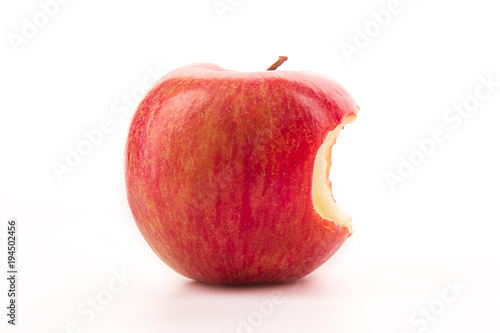 Bitten red apple on a white background.