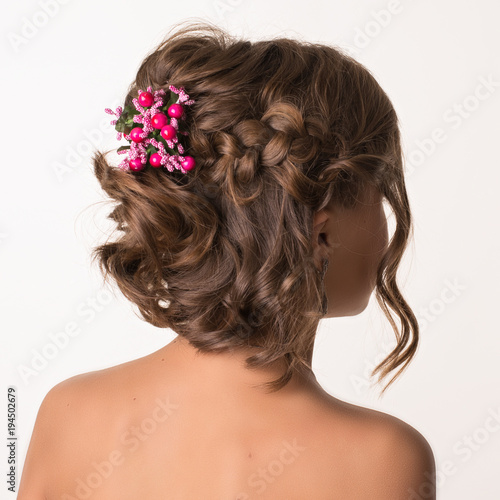 An example of a female hairdress with flowers.