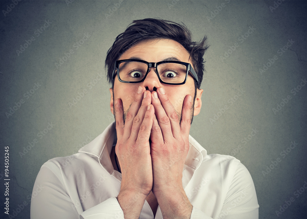 Frightened man in glasses looking at camera Frightened man in glasses looking at camera