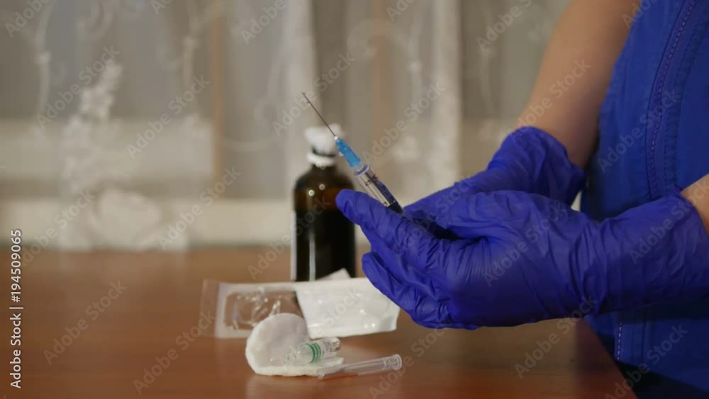 pulling out air bubbles from the hypodermic syringe pulling out air bubbles from the hypodermic syringe
