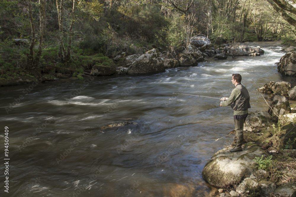 sport fisherman in river, Galicia, Spain. sport fisherman in river, Galicia, Spain.