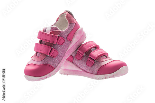 Baby girl small pink sport shoes isolated on white