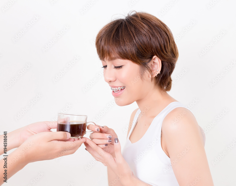 Barista giving cup of coffee to young asia woman. . Isolated on white background. Studio lighting. Concept for healthy. Barista giving cup of coffee to young asia woman. . Isolated on white background. Studio lighting. Concept for healthy.