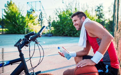 Basketball player resting after the match. Sport, recreation concept photo