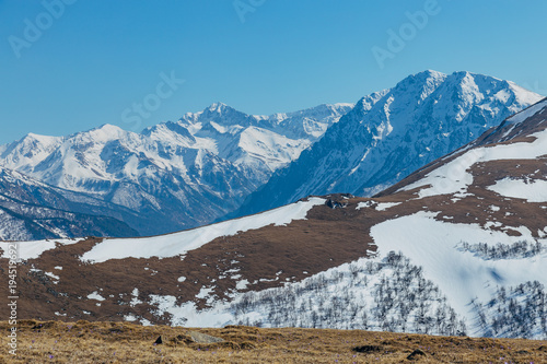 Mountains landscape. Caucasian mountain ridge with snow caps, Arkhyz, Russia