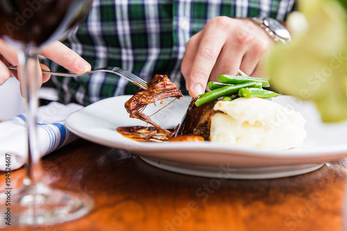 Man eating meal outside photo