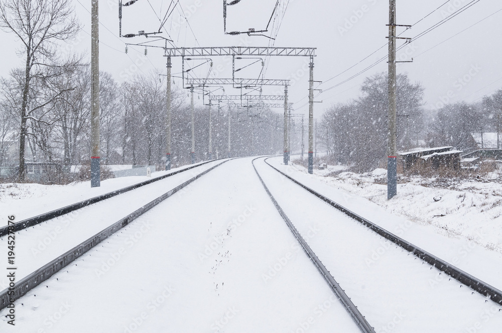 Blizzard on the railway tracks in winter