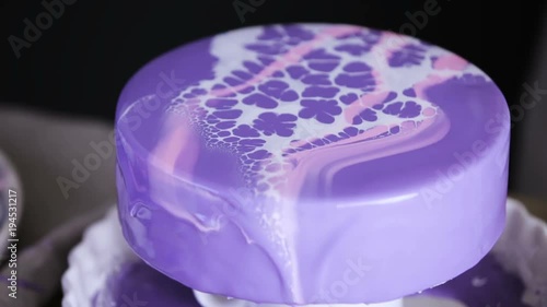 Step by step. Pastre shef glazing mousse cake with purple mirror glaze photo