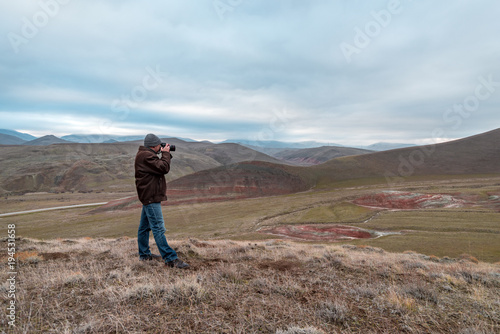 Nature photographer in red mountains