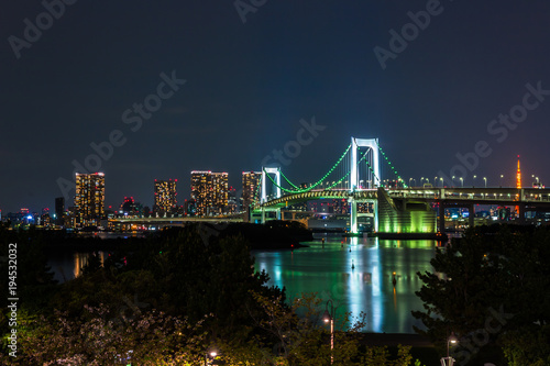 Tokyo skyline at night view from Odaiba with Rainbow bridge and Tokyo tower in the background