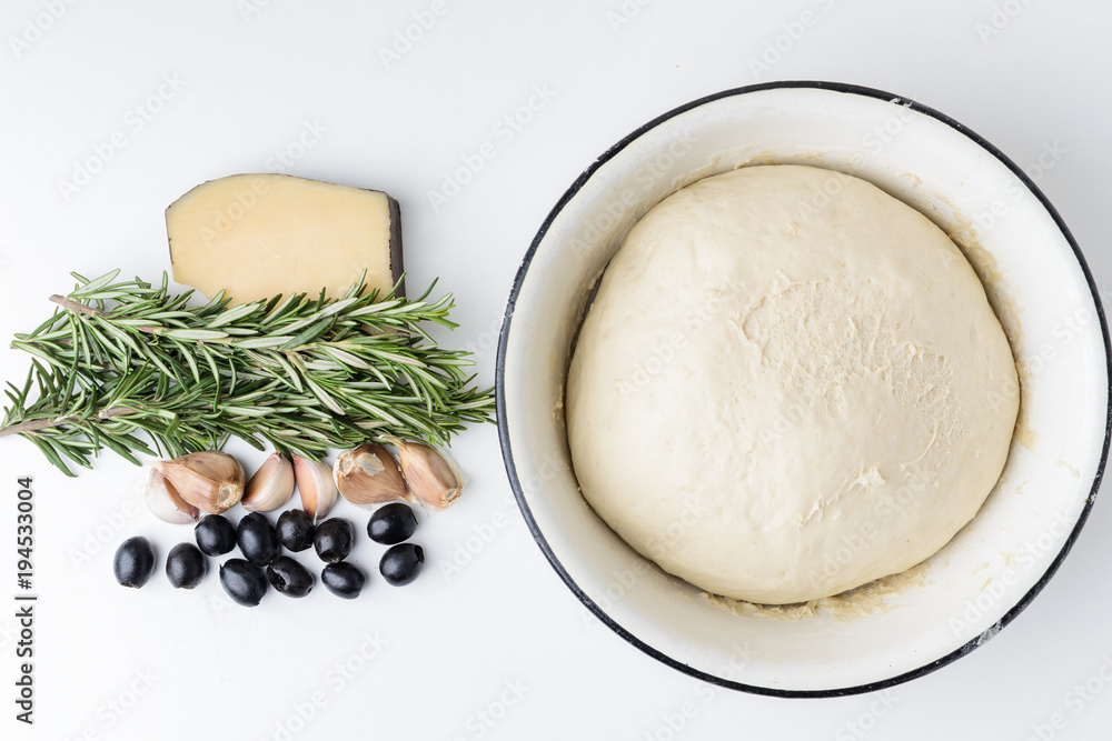Ingredients for Italian focaccia on white background Ingredients for Italian focaccia on white background