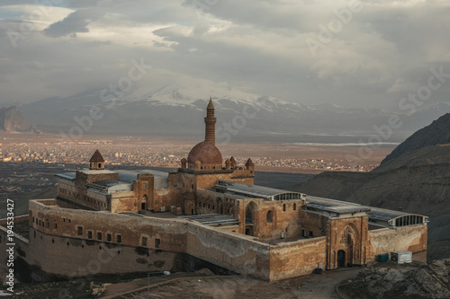 former persian palace in mountain landscape at sunset, ishak pasha palace, dogubayazit, turkey