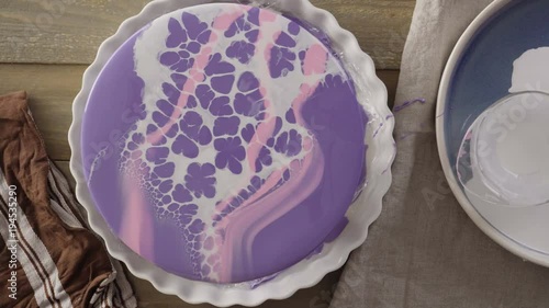 Step by step. Pastre shef glazing mousse cake with purple mirror glaze photo