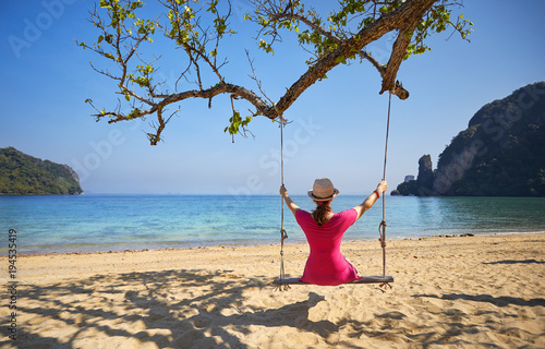Woman at swing at Tropical Island