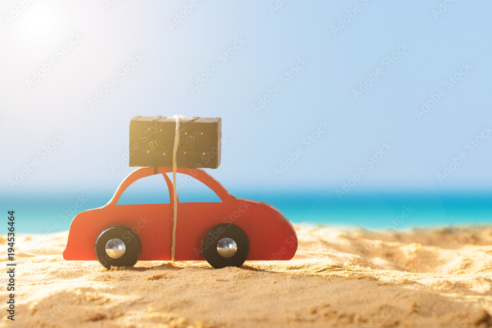 Red Car With Luggage On Sandy Beach Red Car With Luggage On Sandy Beach