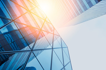 Reflections of modern commercial buildings on glasses with sunlight