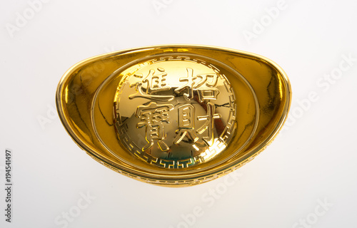 Gold or Chinese gold ingot mean symbols of wealth and prosperity on a background. photo