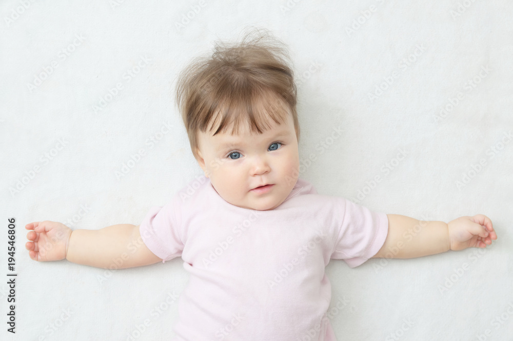 happy smiling baby girl lying on white, portrait little, healthy child care happy smiling baby girl lying on white, portrait little, healthy child care