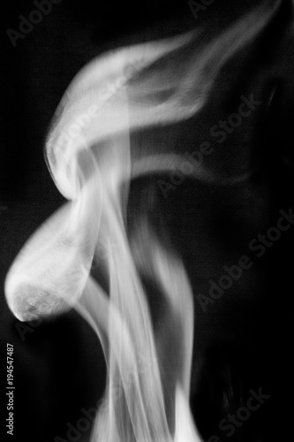 Fototapeta Naklejka Na Ścianę i Meble -  smoke from  fire on a black background, for imposing on images, for artists and designers_