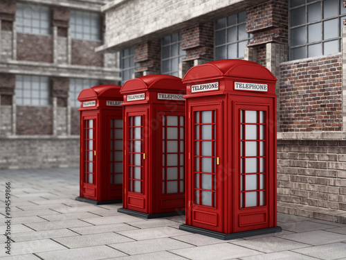 Red British phone booths in the street. 3D illustration