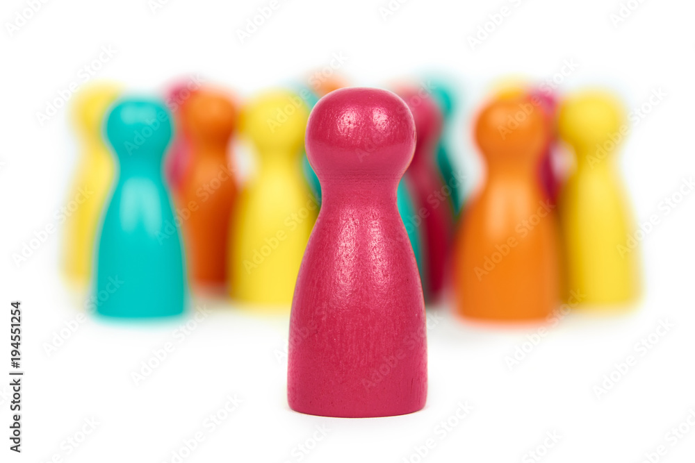 Wooden pawn leisure game figures. Isolated on white background, social idea, immigrants problem. Togetherness Wooden pawn leisure game figures. Isolated on white background, social idea, immigrants problem. Togetherness