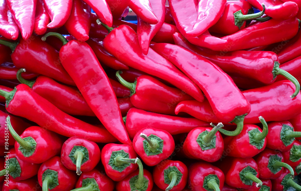 Vegetable background. Large pile of red bell peppers.
