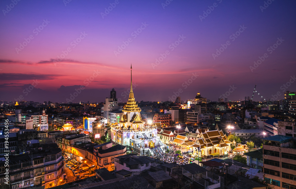 Top view cityscape Wat Trimit  in chinatown or yaowarat area at twilight time  Bangkok  Thailand.