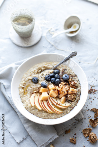 morning oat porridge with fresh fruits and tea photo