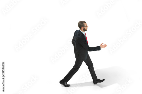 Full body portrait of businessman with folder on white