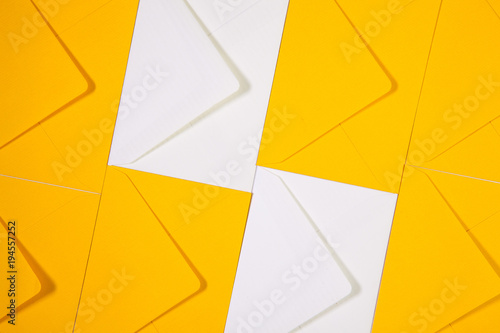 White and yellow envelopes on the  table photo