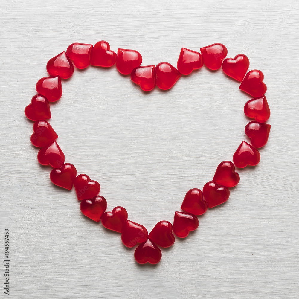 background of red hearts on a white wooden substrate background of red hearts on a white wooden substrate